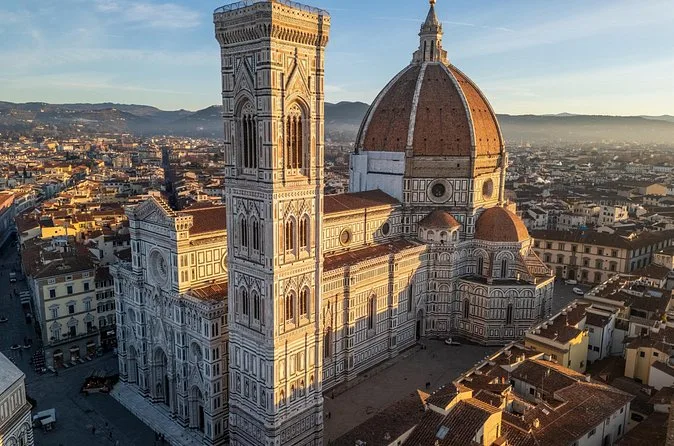 Aerial view of Giotto's Bell Tower beside the dome of Florence Cathedral