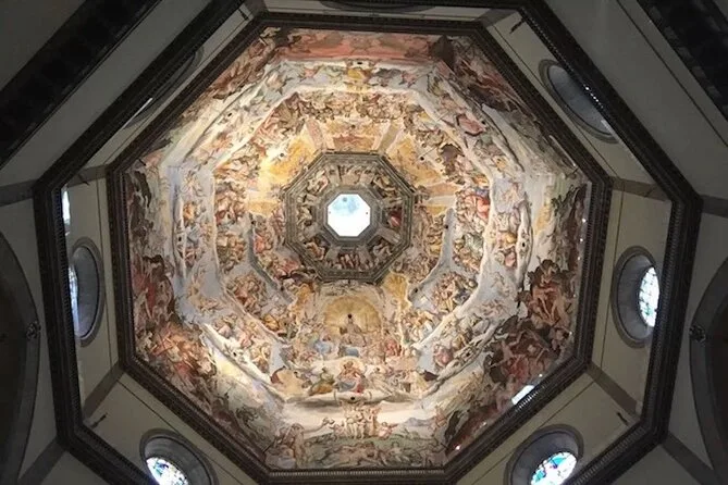 The painted interior of Brunelleschi's dome with rings of fresco figures around the oculus