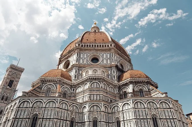 The dome of Florence Cathedral seen from below, with its drum and round windows